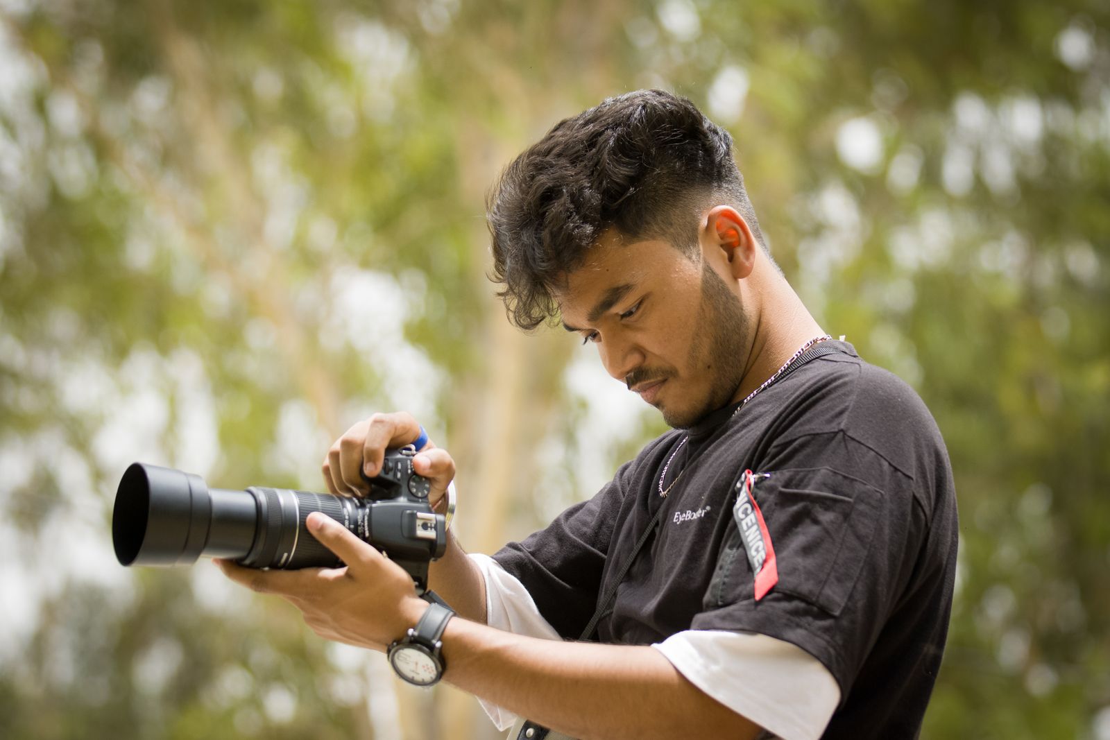 Young Indian photographer creating content with a professional camera
